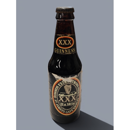 102 - OLD BOTTLE OF GUINNESS