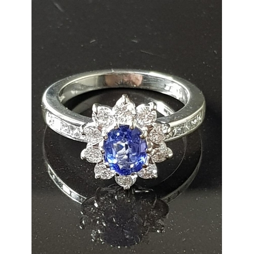 48 - BOODLES SAPPHIRE AND DIAMOND HALO RING SET IN 18CT WHITE GOLD HALO OF BRILLIANT CUT DIAMONDS TOTAL 1... 