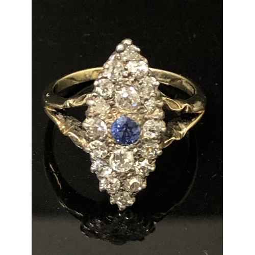 16 - LADIES 9CT YELLOW GOLD MARQUIS SHAPED RING SET WITH ONE ROUND CUT TANZANITE STONE SURROUNDED BY ROUN... 