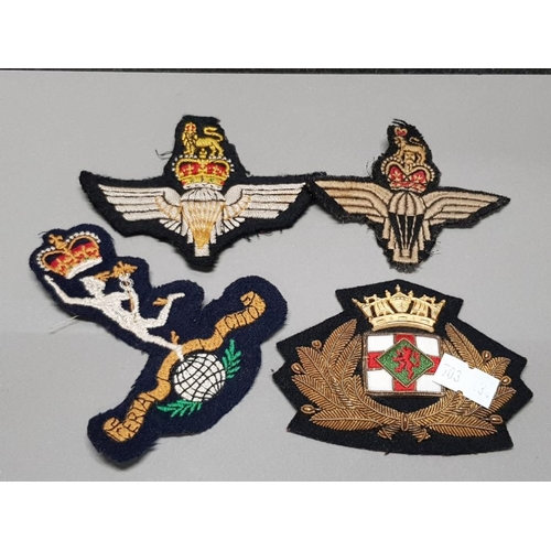 252 - FOUR CLOTH BADGES OF WHICH 3 ARE MILITARY RELATED