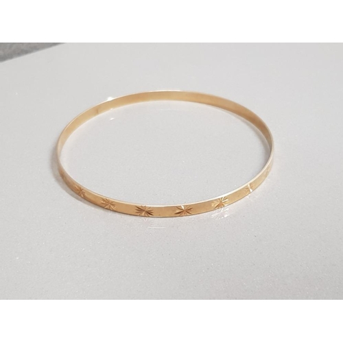 29 - 9CT GOLD STAR PATTERNED SLAVE BANGLE 6.2G