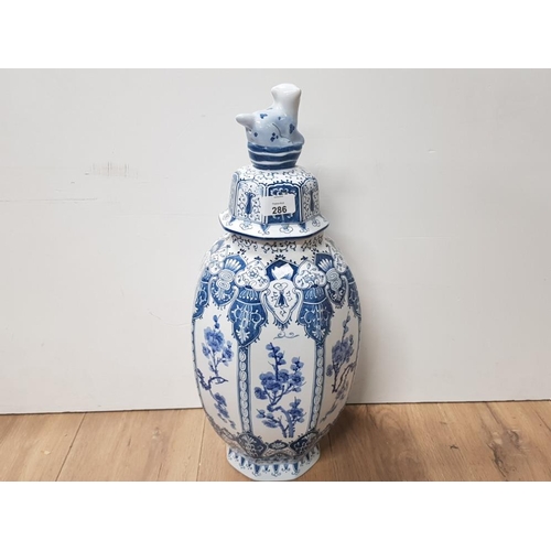 286 - JAPANESE BLUE AND WHITE VASE WITH LIONESS LID