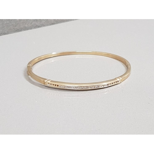 34 - 9CT GOLD DIAMOND BANGLE APX .25CT 9.3G