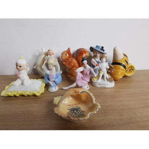 352 - 8 CABINET PIECES TO INCLUDE HUMMEL AND 3 PIN CUSHION LADIES ONE BEING A RARE FLAPPER