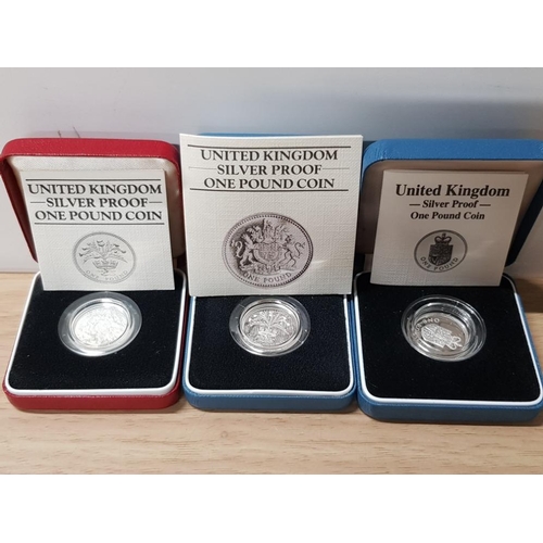 66 - 3 UK 1 POUND SILVER PROOF COINS DATES 1983,1984 AND 1988 IN ORIGINAL CASES