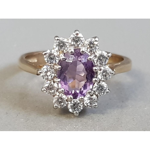 307 - 9CT YELLOW GOLD PURPLE STONE AND CUBIC CLUSTER RING 3.4G SIZE O