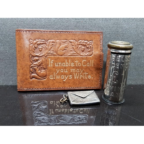 45 - STERLING SILVER STAMPED STAMP ENVELOPE TOGETHER WITH LEATHER STAMP HOLDER AND 1POUND SAVINGS BANK MO... 