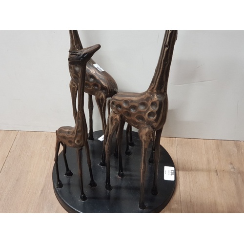 103 - A LARGE STEEL FIGURE OF A FAMILY OF FOUR GIRAFFES 55CM TALL