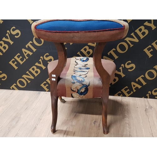 144 - EDWARDIAN MAHOGANY BEDROOM CHAIR WITH UPHOLSTERED SEAT AND BACK REST ON BRASS CASTORS