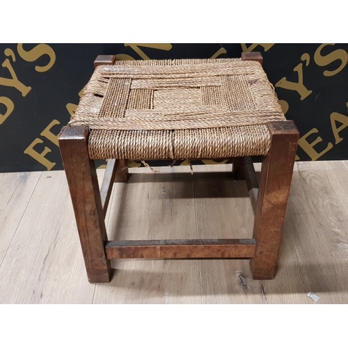 143 - OAK CIRCULAR TOPPED OCCASIONAL TABLE 46CM HEIGHT TOGETHER WITH OAK FRAMED RUSH SEATED FOOTSTOOL 33CM... 