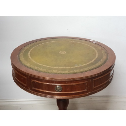 182 - A 2 DRAWER LEATHER CIRCULAR TOPPED DRUM TABLE ON PEDESTAL BASE WITH LION PAW FEET