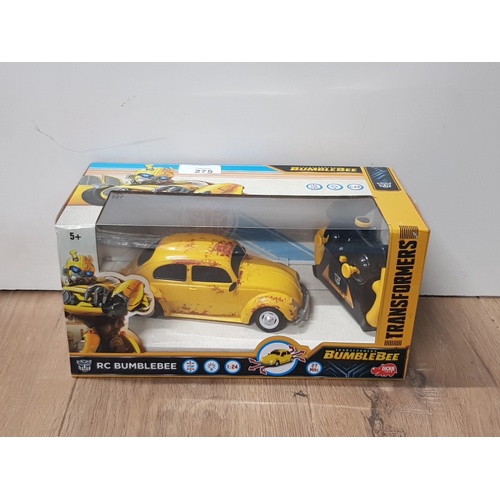 275 - A BOXED BUMBLEBEE TRANSFORMER CAR TOGETHER WITH 10 ELVIS BELTS STILL SEALED