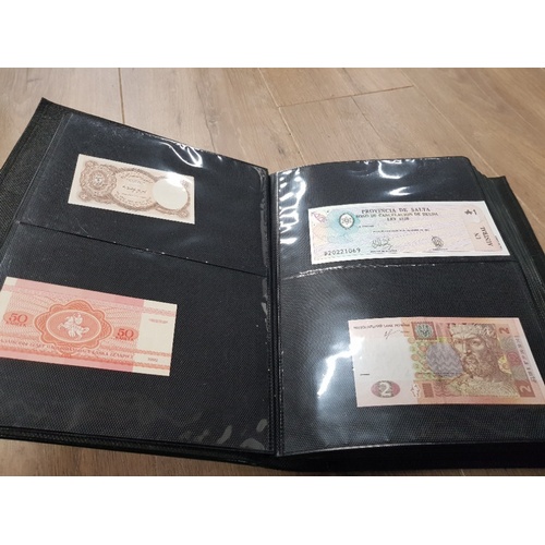 282 - AN ALBUM WHICH CONTAINS UNCIRCULATED 200 WORLD BANK NOTES INCLUDES INDONESIAN AUSTRALIAN ETC