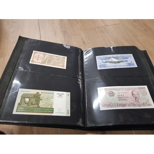 282 - AN ALBUM WHICH CONTAINS UNCIRCULATED 200 WORLD BANK NOTES INCLUDES INDONESIAN AUSTRALIAN ETC