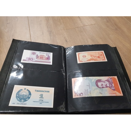 282 - AN ALBUM WHICH CONTAINS UNCIRCULATED 200 WORLD BANK NOTES INCLUDES INDONESIAN AUSTRALIAN ETC