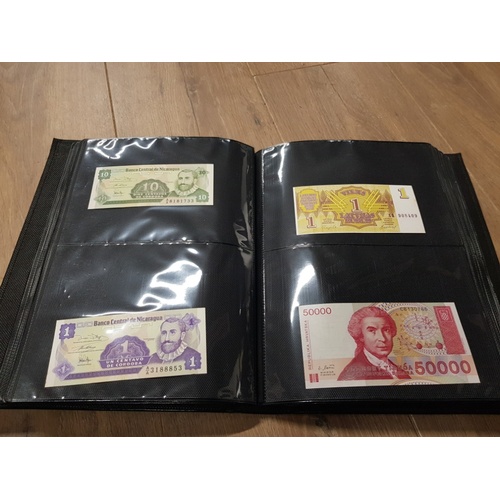 282 - AN ALBUM WHICH CONTAINS UNCIRCULATED 200 WORLD BANK NOTES INCLUDES INDONESIAN AUSTRALIAN ETC