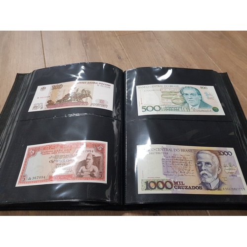 282 - AN ALBUM WHICH CONTAINS UNCIRCULATED 200 WORLD BANK NOTES INCLUDES INDONESIAN AUSTRALIAN ETC