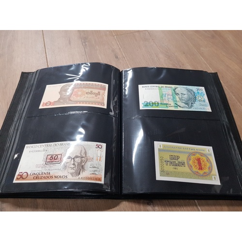 282 - AN ALBUM WHICH CONTAINS UNCIRCULATED 200 WORLD BANK NOTES INCLUDES INDONESIAN AUSTRALIAN ETC