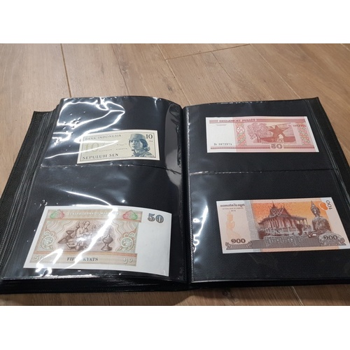 282 - AN ALBUM WHICH CONTAINS UNCIRCULATED 200 WORLD BANK NOTES INCLUDES INDONESIAN AUSTRALIAN ETC