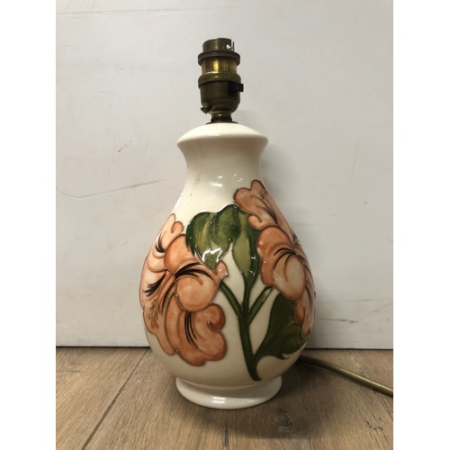 325 - A MOORECROFT HIBISCUS PATTERNED TABLE LAMP ON CREAM BACKGROUND