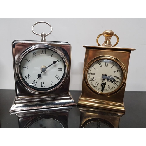 379 - HEAVY BRASS QUARTZ TRAVELLING CLOCK WITH A PLATED SIMILAR CLOCK