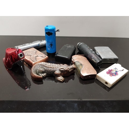 383 - BOX CONTAINING 10 MISCELLANEOUS NOVELTY LIGHTERS CROCODILE, LADYS HIGH HEEL ETC