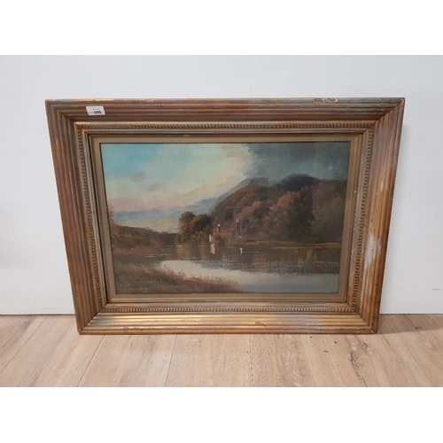 399 - GILT FRAMED OIL ON CANVAS OF A LAKE SCENE SIGNED INDISTINCT 38CM X 59CM