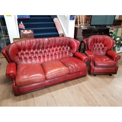 405 - LEATHER BUTTONED BACK 3 SEATER SETTEE AND MATCHING ROCKING CHAIR IN OX BLOOD IN THE STYLE OF AND DES... 