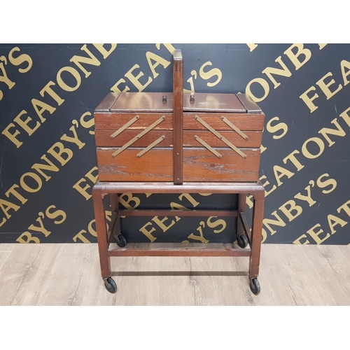 134 - VINTAGE MAHOGANY CANTILEVER SEWING BOX TROLLEY PLUS CONTENTS