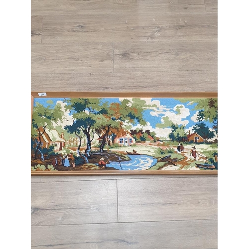 177 - A FRAMED TAPESTRY OF A VILLAGE SCENE WITH PEOPLE FISHING BASED AROUND THE 1800S