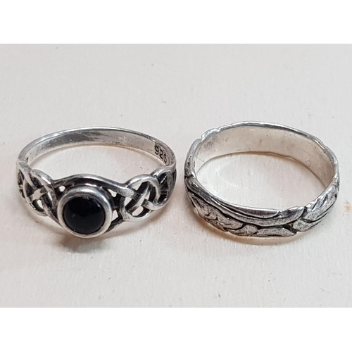 242 - 2 STAMPED 925 SILVER RINGS, 1 WITH ONYX CENTRE STONE SIZE K AND 1 NICELY DECORATED BAND SIZE I OVERA... 