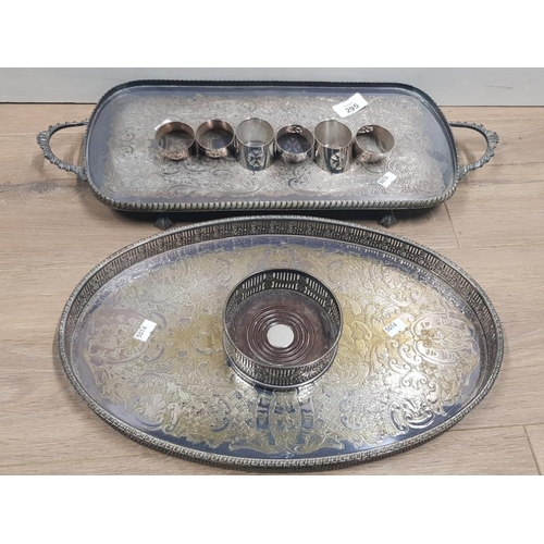 295 - A SILVER PLATED GALLERIED DRINKS TRAY AN OBLONG SILVER PLATED DRINKS TRAY AND BOTTLE COASTER AND SET... 