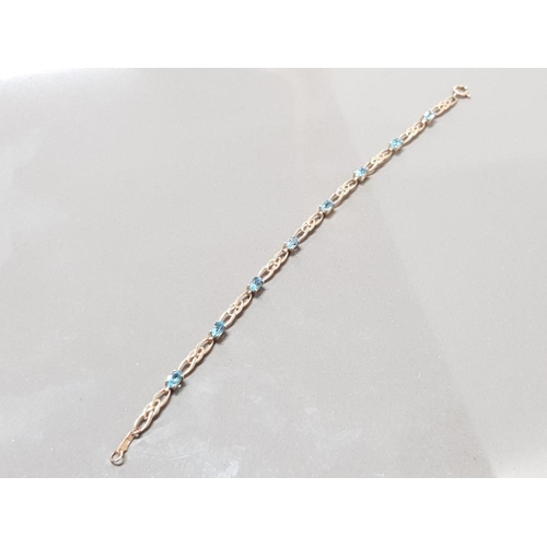 125 - 9CT YELLOW GOLD BLUE TOPAZ BRACELET 4.8GRAMS