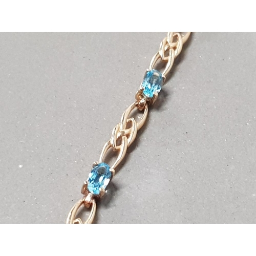 125 - 9CT YELLOW GOLD BLUE TOPAZ BRACELET 4.8GRAMS