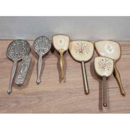 302 - 3 PIECE SILVER PLATED MIRROR AND BRUSH SET TOGETHER WITH 2 BRASS PETIT POINT DECORATION PLUS 2 HAIR ... 