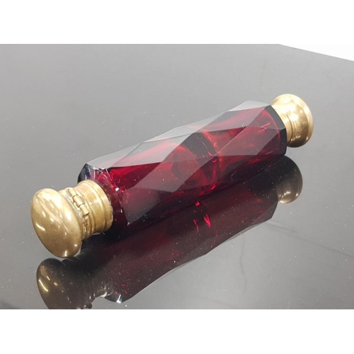 314 - MID LATE VICTORIAN DOUBLE ENDED SCENT BOTTLES IN CRANBERRY GLASS WITH ORIGINAL STOPPERS UNDER CAPS