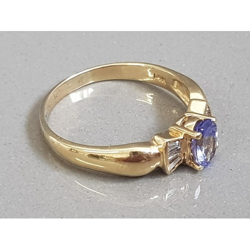 34 - LARGE 14CT GOLD AND 3/4CT OVAL TANZANITE WITH DIAMOND ACCENTS 4G SIZE T