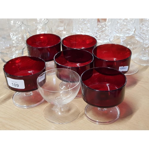 109 - LARGE QUANTITY OF MISCELLANEOUS GLASS WARE INCL WATER JUGS, SUNDAE DISHES AND RED GLASS ETC