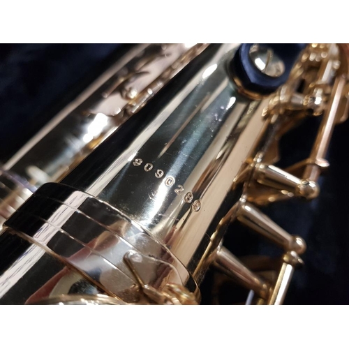 132 - AN ELKHART SERIES II BRASS SAXOPHONE NO 9090289 BOXED