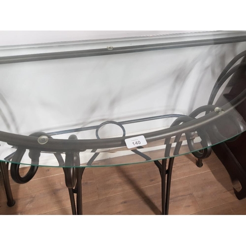 140 - A METAL AND BEVELLED GLASS TOP DEMI LUNE SIDE TABLE 125 X 75 X 43CM