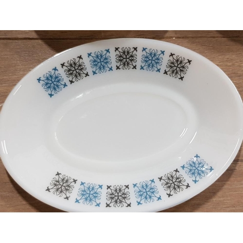 143 - 30 PIECE DINNER SET WITH BLACK AND BLUE DECORATIVE PATTERN