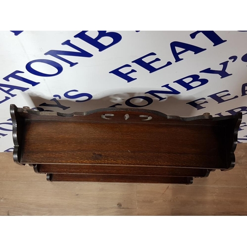 151 - AN EDWARDIAN OAK THREE TIER WALL SHELF 56CM WIDE