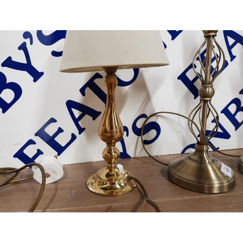 166 - A PAIR OF MODERN BRASS EFFECT TABLE LAMPS 42CM HIGH TOGETHER WITH A SMALLER BRASS TABLE LAMP