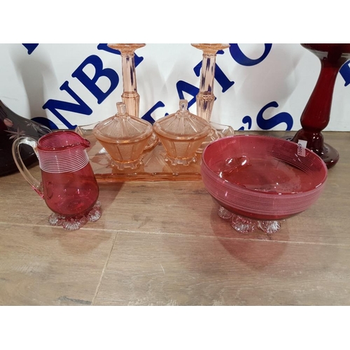 193 - GLASSWARE COMPRISING TWO PIECES OF CRANBERRY AN ART DECO DRESSING TABLE SET A SHIPS DECANTER AND A V... 