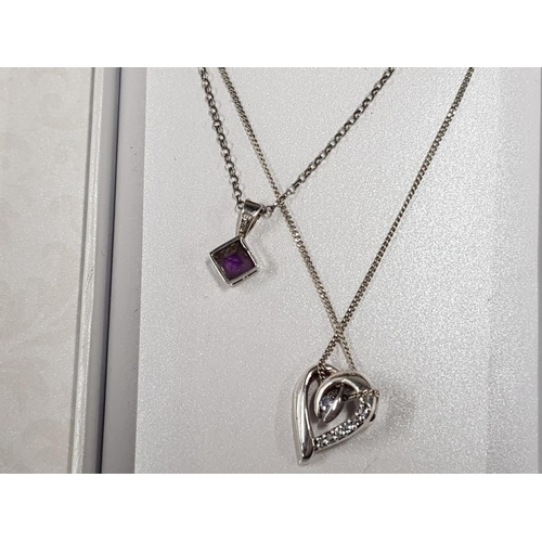 49 - 2 SILVER AND SEMI PRECIOUS AMETHYST PENDANTS ON CHAINS IN ORIGINAL GIFT BOX