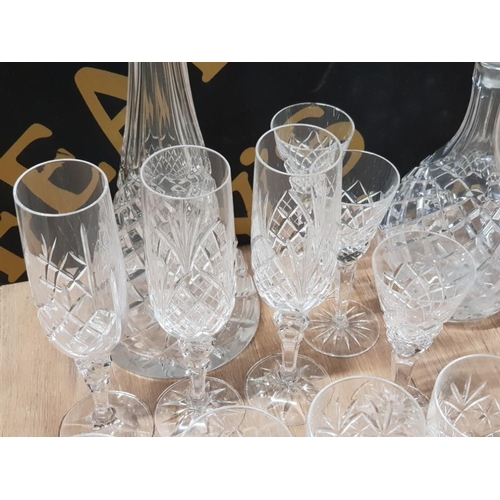 310 - 2 CRYSTAL DECANTERS WITH STOPPERS AND 14 DRINKING GLASSES