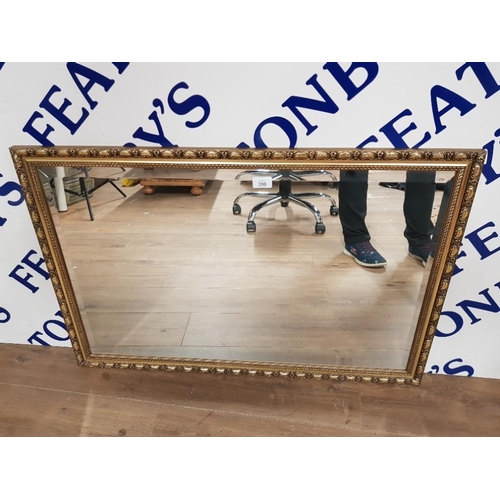 398 - A MODERN BEVELLED WALL MIRROR IN GOLD COLOURED FRAME 60 X 90.5CM