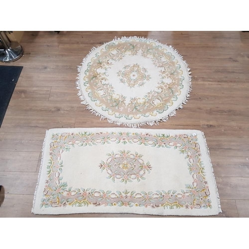 399 - CIRCULAR SHAPED FLORAL PATTERNED FRINGED RUG DIAMETER 124CM, TOGETHER WITH MATCHING RECTANGULAR SHAP... 