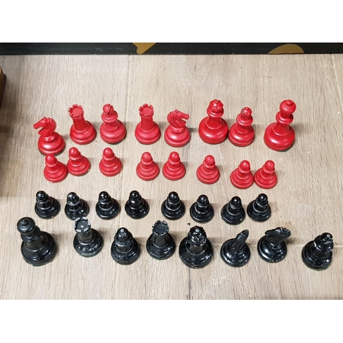 438 - A RED AND BLACK PAINTED METAL CHESS SET TOGETHER WITH TWO VINTAGE TINS