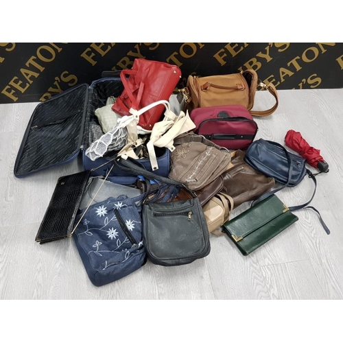 131 - SUITCASE CONTAINING A LARGE QUANTITY OF LADYS HANDBAGS, SOME GENUINE LEATHER ETC